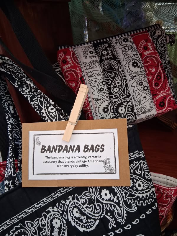 Hand-sewn red, black and white bandana bags displayed at Tunnel Mountain Crafts