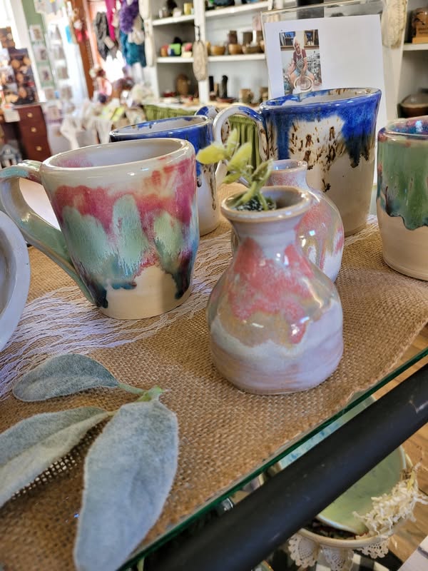 Pastel glazed handmade mugs and vase displayed at Tunnel Mountain Crafts